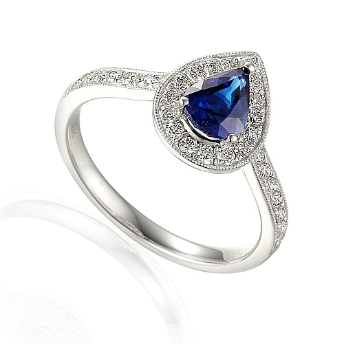 Claw Set Pear Shape Cut Blue Sapphire With Round Brilliant Diamond Halo & Shoulders Ring