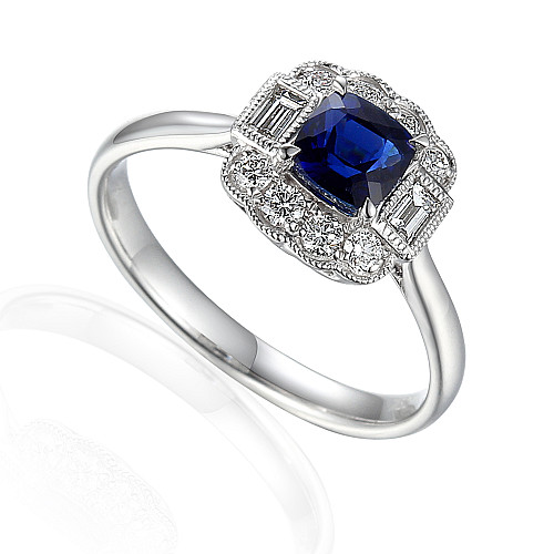 Claw Set Cushion Cut Blue Sapphire With Baguette Cut Diamond And Micro Set Round Brilliant Diamond Halo Ring