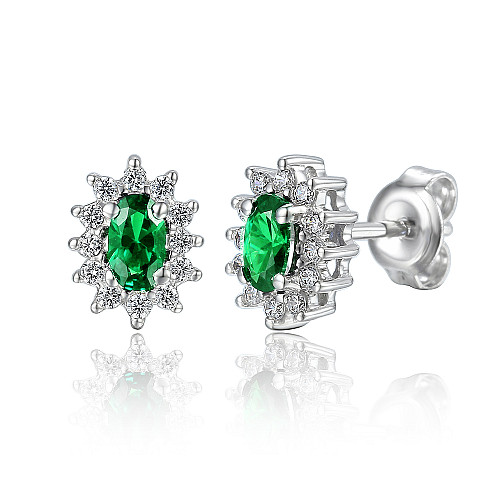 Claw Set Oval Cut Emerald And Round Brilliant Cut Diamond Cluster Earrings