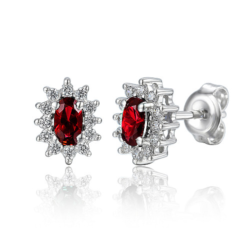 Claw Set Oval Cut Ruby And Round Brilliant Cut Diamond Cluster Earrings