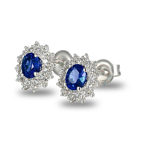 Claw Set Oval Cut Blue Sapphire And Round Brilliant Cut Diamond Cluster Earrings