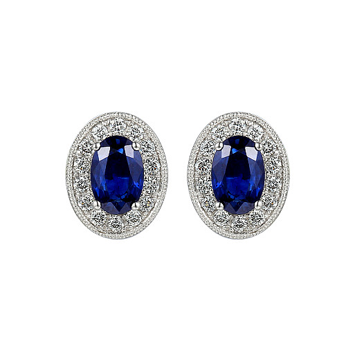 Claw Set Oval Cut Blue Sapphire With Micro Set Round Brilliant Cut Diamond Halo Earrings