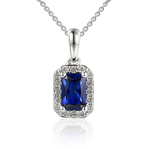Claw Set Emerald Cut Blue Sapphire With Micro Set Diamond Halo Pendant And Chain