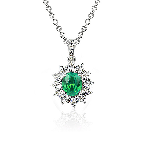 Claw Set Oval Cut Emerald And Round Brilliant Cut Diamond Cluster Pendant And Chain