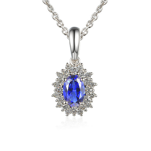 Claw Set Oval Cut Tanzanite And Round Brilliant Cut Diamond Cluster Pendant And Chain