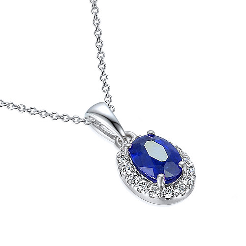 Claw Set Oval Cut Blue Sapphire With Micro Set Diamond Halo Pendant And Chain