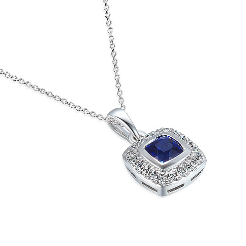 Rubover Set Cushion Cut Blue Sapphire With Micro Set Round Brilliant Cut Diamond Halo Pendant And Chain